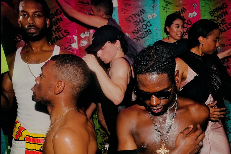 A scene from a dance floor: several PoC dancing close together.