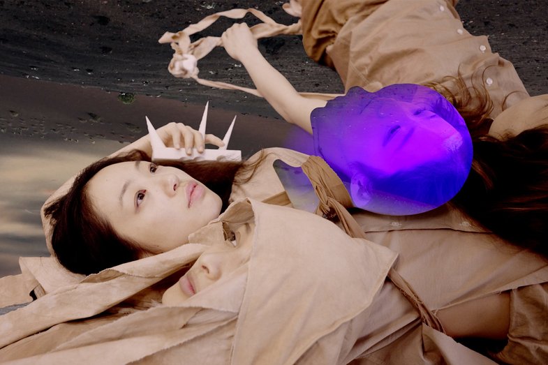 Several people are lying on the floor. One head is enclosed in a pink bubble.