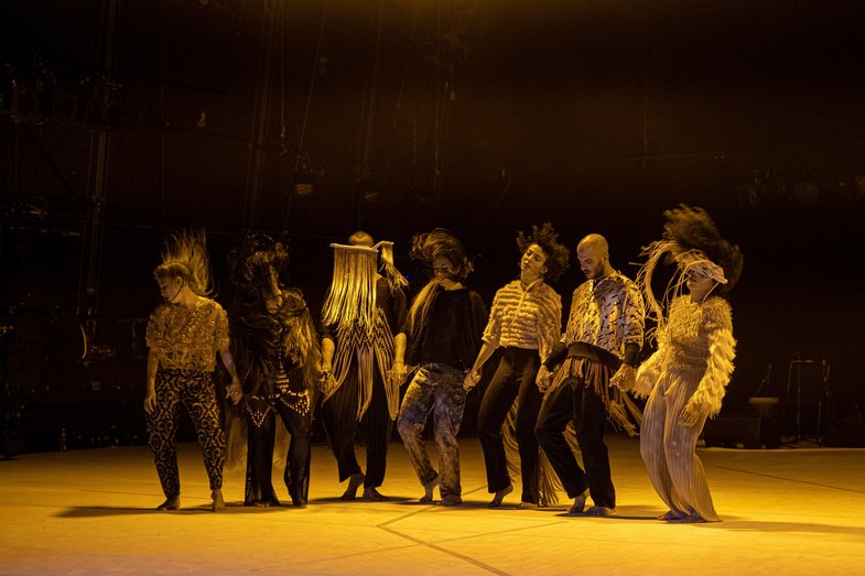 A group of people dance on stage.