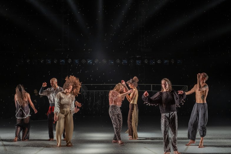 A group of people dance on stage.