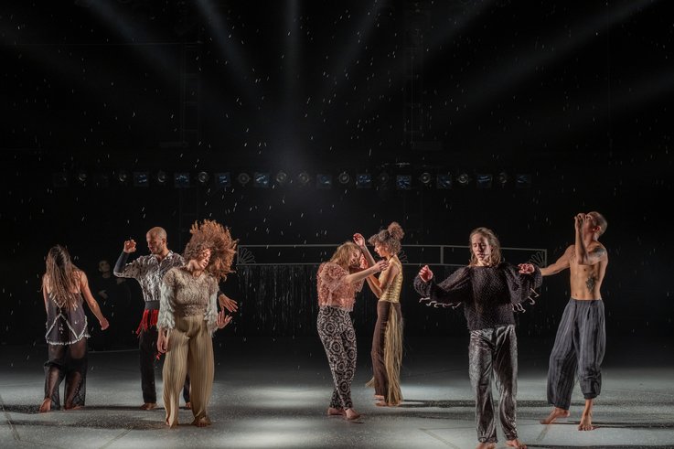 A group of people dance on stage.